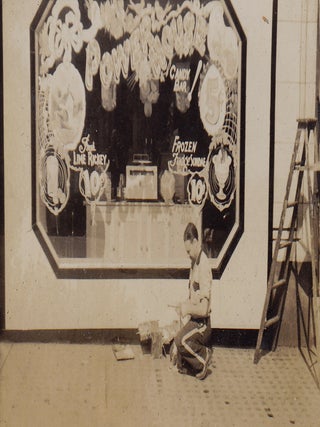 Photo Album Documenting Power House Candy Bar Window Paintings and Other Marketing Efforts.