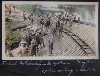[Album of Hand-Colored Photographs Taken and Captioned by Prolific Postcard Maker].